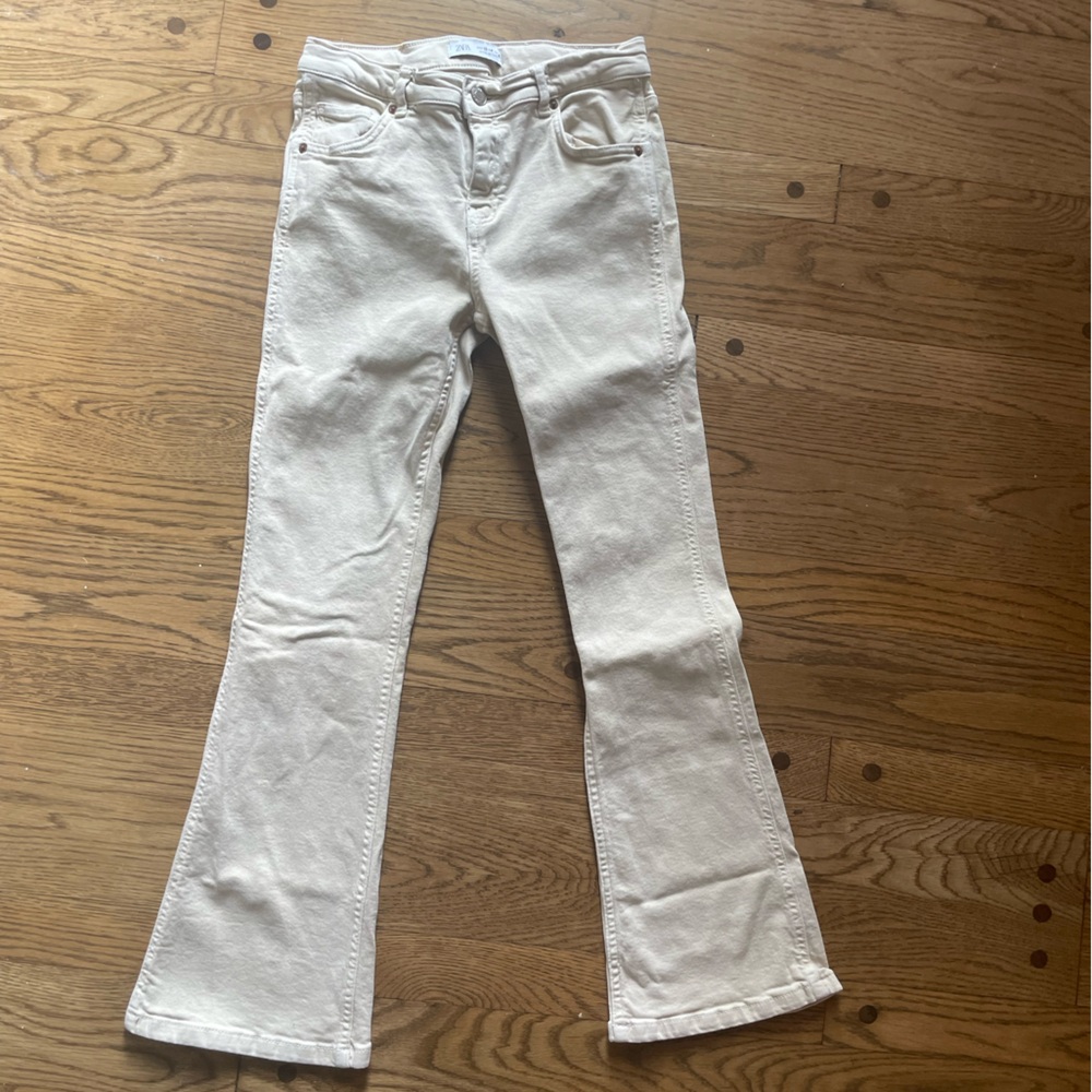 ZARA girls cream flare leg jeans.